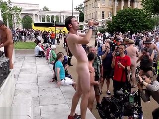 Sexy naked man plays trumpet in London town square