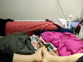 Playing with my feet on the bed