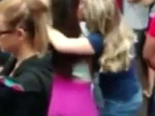 lesbians kissing wildly in a outdoor party