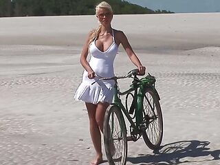 Passionate fucking on the beach with a stunning blonde with big tits