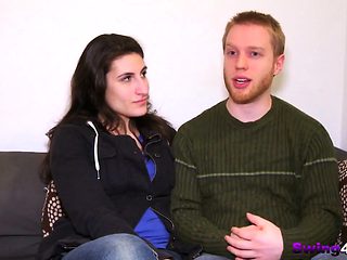 Swinger couples play with water in the nude