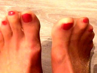 Red nails and feet in tan pantyhose