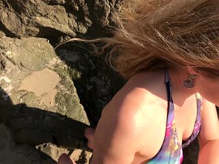 Model blows photographer on the beach and swallows cum