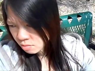 Asian girl sucking dick and swallowing at the park