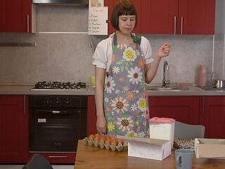 Watch horny solo girl Sandy Chees pleasuring her pussy in the kitchen