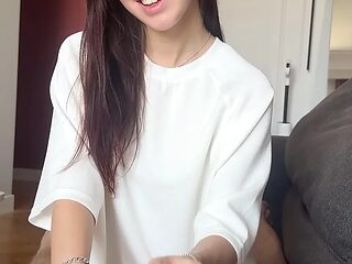 Ria Reigns wraps her fingers around your throbbing cock in a POV blowjob scene.