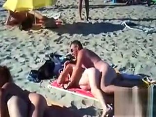 Swingers Having Fun Outdoors At A Beach