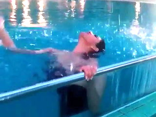 Tattoo girl in swimming pool