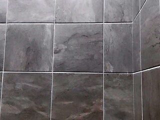 Tattooed goth Raven Black jerks off in public gym shower
