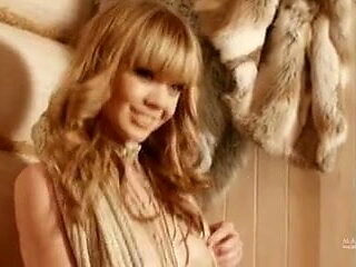 Russian model stunner strips in front of fire