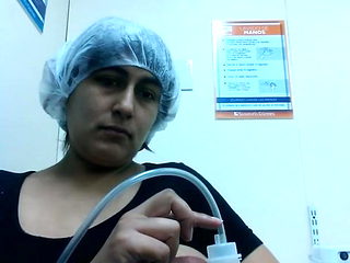 Latina pumping milk form big brown areola