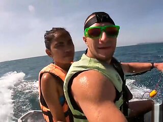 Amateur Thai girlfriend gives him a blowjob in public