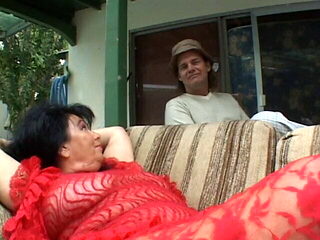 MILF with huge breasts rides a big cock outside