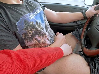 Girl gives a blowjob while the guy drives the car