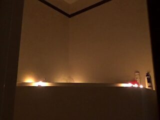 All-natural petite teen enjoys bathtub fantasy with candles