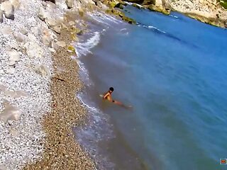 Busty tourist cutie sucks and worships big cock on the beach