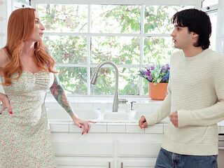 The red-haired beauty Sophia Locke fucks away with her man in the kitchen.