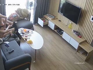 Young couple in livingroom, riding on sofa