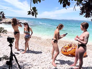 Two hot lesbians Rebeka Ruby and Miss Pussycat are having fun on the beach.