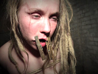 Clamps at the Body of a Tied up Moaning Witch