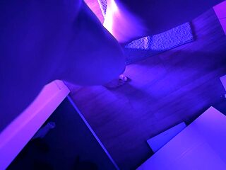 Real couple gets naughty in the bathroom under blue lights.