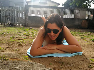 Wife sunbathing naked in front yard