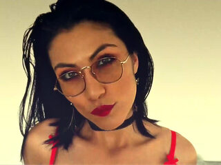 Latina with a Sensual Body Posing in Her Latex Skirt