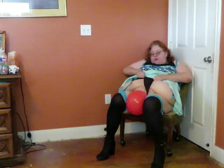 Nurse Vicki plays with a rubber ball in a mini skirt, sexy stockings and high heel mini boots