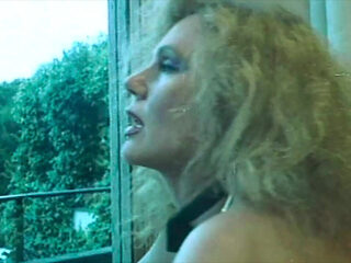 Marina Lotar in 2 Vintage Scenes: a Threesome and Doggy Style with Roberto Malone.