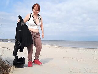 Biker babe strips bare & rubs her hot pussy on the wild beach