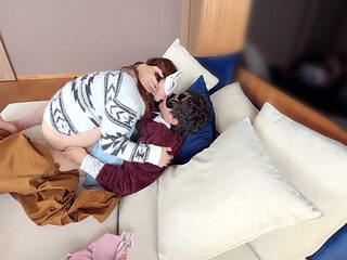 On the Sofa in Their Secret Room, They Shared Passionate Kisses Before Making Love, Expressing Their Deep Love.