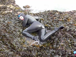 Rubbery Beach Encounter: Lucy's Neoprene Pussy Play with Stranger