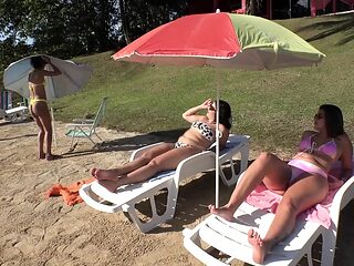 Lesbian girls lick each other's asses at the nude beach