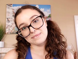 Brunette Leana Lovings seduces with her shaved pussy and glassed gaze