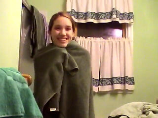 Cute brunette teen soaps up in the shower and takes time to trim her bush