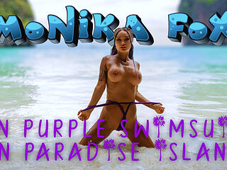 Sexy Monika Fox in Purple Swimsuit on Paradise Island