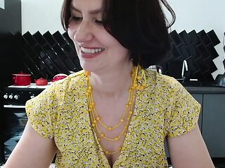 Mature milf with big natural tits and long legs spreads her legs wide as