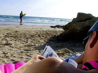 Young girl in sunglasses enjoys a sunny day on the beach before two lucky