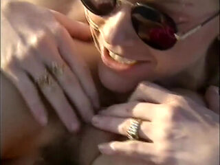 Lesbians pussy licking fingering on the beach