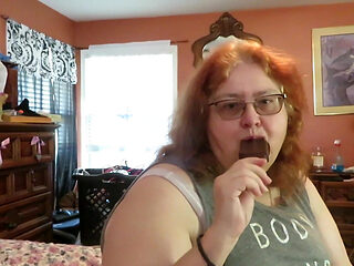 BBW nurse Vicki enjoys eatting a chocolate vanilla ice cream popsiscle